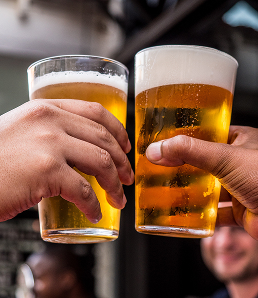 People drinking beer glasses